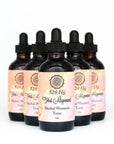 Five amber dropper bottles of herbal women's tonic with pastel labels on white background