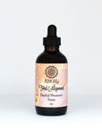 Herbal women's tonic in amber dropper bottle with pink marbled label on white background